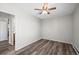 Bedroom with ceiling fan, closet, and new flooring at 495 S Dayton St # 1D, Denver, CO 80247