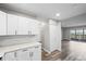 This modern kitchen features shaker cabinets, quartz counters, and stainless appliances at 495 S Dayton St # 1D, Denver, CO 80247