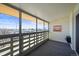 Enclosed patio with privacy screen and a neighborhood view through the windows at 495 S Dayton St # 1D, Denver, CO 80247