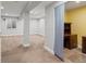Spacious basement with carpeting, columns, a window, and an office area with a desk at 5541 S Eaton St, Littleton, CO 80123