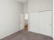 Cozy bedroom features neutral carpet, closet with double doors, and an open doorway at 5541 S Eaton St, Littleton, CO 80123