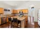 Well-appointed kitchen featuring an island, stainless steel appliances, and lovely backsplash at 5541 S Eaton St, Littleton, CO 80123