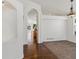 A bright living room area with hardwood floors, neutral colors, and seamless transition to the kitchen at 5541 S Eaton St, Littleton, CO 80123