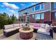 Outdoor patio space with a fire pit and plush seating with an attached outdoor deck at 6577 Esperanza Dr, Castle Pines, CO 80108