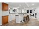 Finished basement bar area with ample cabinet space and seating for entertaining guests at 6577 Esperanza Dr, Castle Pines, CO 80108