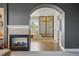 Lavish primary bathroom featuring fireplace, soaking tub, and glass shower at 6577 Esperanza Dr, Castle Pines, CO 80108