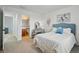 Bright bedroom with attached bath, vanity, and serene decor at 6577 Esperanza Dr, Castle Pines, CO 80108