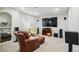 Cozy media room with comfortable seating and a large screen television for entertainment at 6577 Esperanza Dr, Castle Pines, CO 80108