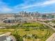 Panoramic aerial shot showcases the stunning downtown skyline, riverfront, and green spaces, all under a beautiful blue sky at 2955 Inca St # 2Q, Denver, CO 80202