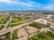Wide aerial photograph presents a mix of city, park and river views at 2955 Inca St # 2Q, Denver, CO 80202