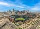 Aerial view showcasing the city skyline and nearby baseball stadium at 2955 Inca St # 2Q, Denver, CO 80202