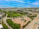 Expansive aerial view highlights the city's skatepark, green spaces, and surrounding urban landscape with a mountain backdrop at 2955 Inca St # 2Q, Denver, CO 80202