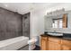 Modern bathroom with a soaking tub, unique sink basin, and sleek fixtures at 2955 Inca St # 2Q, Denver, CO 80202