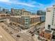 Urban street view of multi-story building with shops and restaurants at 2955 Inca St # 2Q, Denver, CO 80202