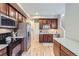 Bright kitchen with wood cabinets, stainless steel appliances, and white countertops at 10148 E 29Th Dr, Denver, CO 80238