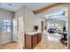 Open-concept living area with wood floors, beige walls, and natural light from windows at 10148 E 29Th Dr, Denver, CO 80238