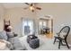 Open floorplan living room features a sliding glass door and easy access to the dining room at 10148 E 29Th Dr, Denver, CO 80238