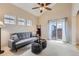 Cozy living room features vaulted ceilings, ceiling fan, and large windows that provide plenty of natural light at 10148 E 29Th Dr, Denver, CO 80238