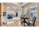 Open-concept living space with hardwood floors leading to a carpeted living room and sliding door at 10148 E 29Th Dr, Denver, CO 80238