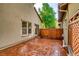 Private back patio featuring a stained concrete surface and wood fence at 10148 E 29Th Dr, Denver, CO 80238