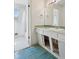 Retro bathroom with unique vanity details and natural light at 1742 S Forest St, Denver, CO 80222