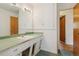 Bathroom featuring vanity sink and a doorway to other rooms at 1742 S Forest St, Denver, CO 80222