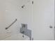 Bathroom features a tub and shower with dated tile and fixtures at 1742 S Forest St, Denver, CO 80222