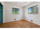 Bedroom features hardwood floors and two windows providing ample natural light at 1742 S Forest St, Denver, CO 80222