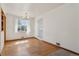 Bright dining area with hardwood floors, natural light, and simple décor at 1742 S Forest St, Denver, CO 80222