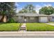 Inviting single-story home with a tidy front yard and a walkway leading to the entrance at 1742 S Forest St, Denver, CO 80222