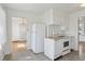 Bright kitchen featuring white appliances and classic design at 1742 S Forest St, Denver, CO 80222