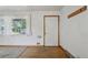 Bright living room with hardwood floors, large windows, and fresh paint at 1742 S Forest St, Denver, CO 80222