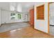 Sunlit living room with hardwood floors, natural light, ceiling fan, and an open floor plan at 1742 S Forest St, Denver, CO 80222
