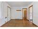 Spacious living room featuring hardwood floors, fresh paint, and lots of natural light at 1742 S Forest St, Denver, CO 80222