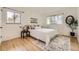 Cozy bedroom with hardwood floors, natural light, and simple decor at 2822 S Zenobia St, Denver, CO 80236