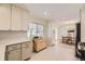 Bright kitchen featuring modern cabinets, butcher block island, and stainless steel appliances at 2822 S Zenobia St, Denver, CO 80236