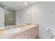 Bathroom featuring a double vanity, large mirror, and a toilet at 30 Garfield St # G, Denver, CO 80206