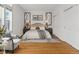 Cozy bedroom featuring large windows, closet and hardwood floors at 30 Garfield St # G, Denver, CO 80206