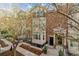 Charming townhome featuring a brick facade, balcony, and well-maintained landscaping for enhanced curb appeal at 30 Garfield St # G, Denver, CO 80206