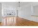 Spacious living room with hardwood floors, a fireplace, and a large bay window at 30 Garfield St # G, Denver, CO 80206