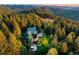 Secluded home with a deck and hot tub, surrounded by dense forest, providing privacy and scenic views at 13416 Kuehster Rd, Littleton, CO 80127