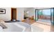 Bedroom features access to an outdoor balcony with scenic views, enhancing the tranquil and airy atmosphere at 13416 Kuehster Rd, Littleton, CO 80127