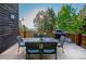 Outdoor dining area on a spacious deck with a grill and mountain views at 13416 Kuehster Rd, Littleton, CO 80127