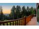 Enjoy the panoramic mountain views from the deck with wood railing at 13416 Kuehster Rd, Littleton, CO 80127