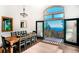 Dining area featuring a large window and french doors offering scenic mountain views, perfect for entertaining at 13416 Kuehster Rd, Littleton, CO 80127
