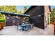 Exterior shot of the deck and house with lovely outdoor seating, showcasing an outdoor oasis at 13416 Kuehster Rd, Littleton, CO 80127