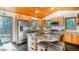 Bright kitchen with wood cabinets, granite countertops, and stainless steel appliances at 13416 Kuehster Rd, Littleton, CO 80127