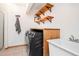Efficient laundry room with modern washer/dryer, ample counter space, shelving and sink at 13416 Kuehster Rd, Littleton, CO 80127