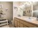 Bright bathroom featuring double sinks, a large mirror, and stylish decor at 10818 Cimarron St # 1202, Firestone, CO 80504