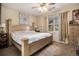 Serene main bedroom boasting a decorative bed, large window, and neutral decor for ultimate relaxation at 10818 Cimarron St # 1202, Firestone, CO 80504